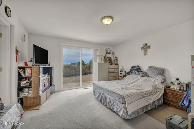 a bedroom with a bed and a view of bedroom