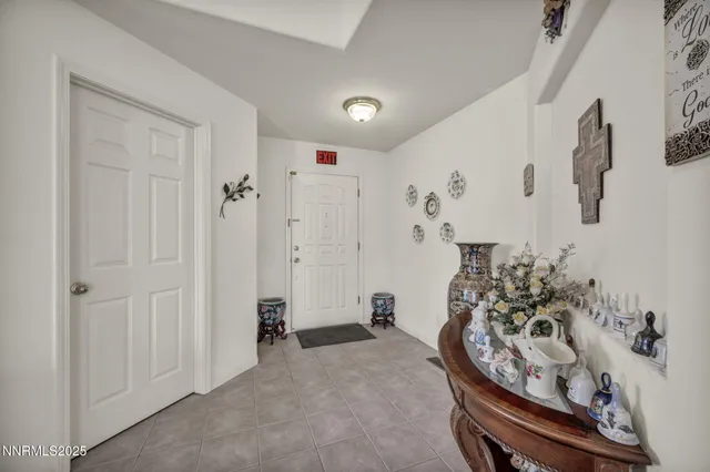 a living room with furniture and flowers