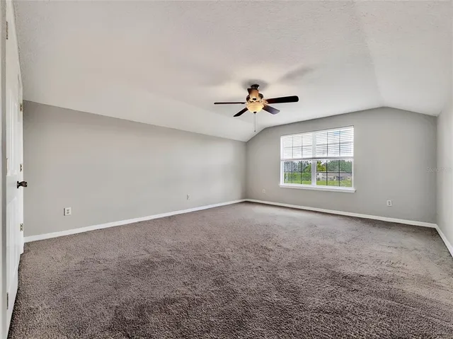 an aerial view of a house with a garden and swimming pool