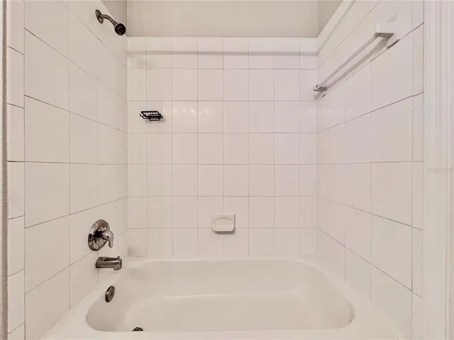 an aerial view of residential houses with outdoor space and swimming pool