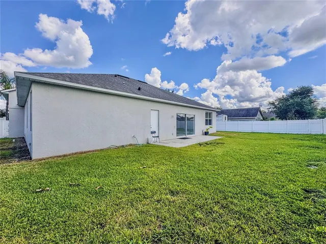a view of a chairs and table in the patio