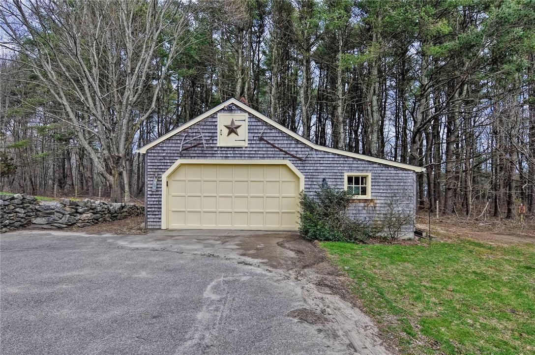 391 West Greenville Road Scituate, RI 02857 - Photo 31 of 36 Over Sized 2 Car Garage with Ample Storage and Garage Door Opener