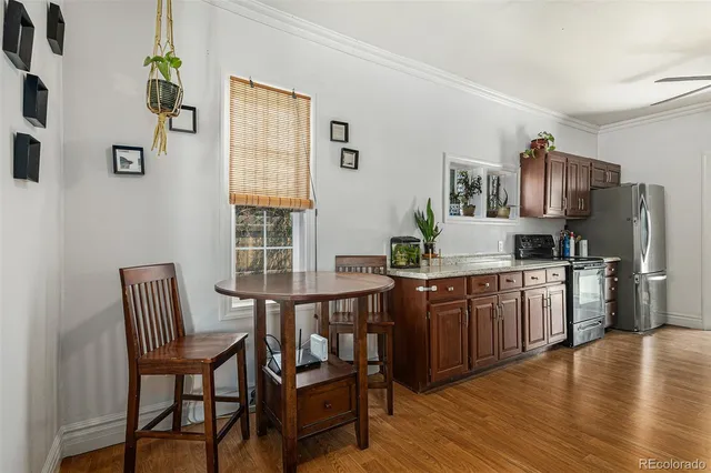 a kitchen with stainless steel appliances granite countertop a stove a sink dishwasher and a refrigerator