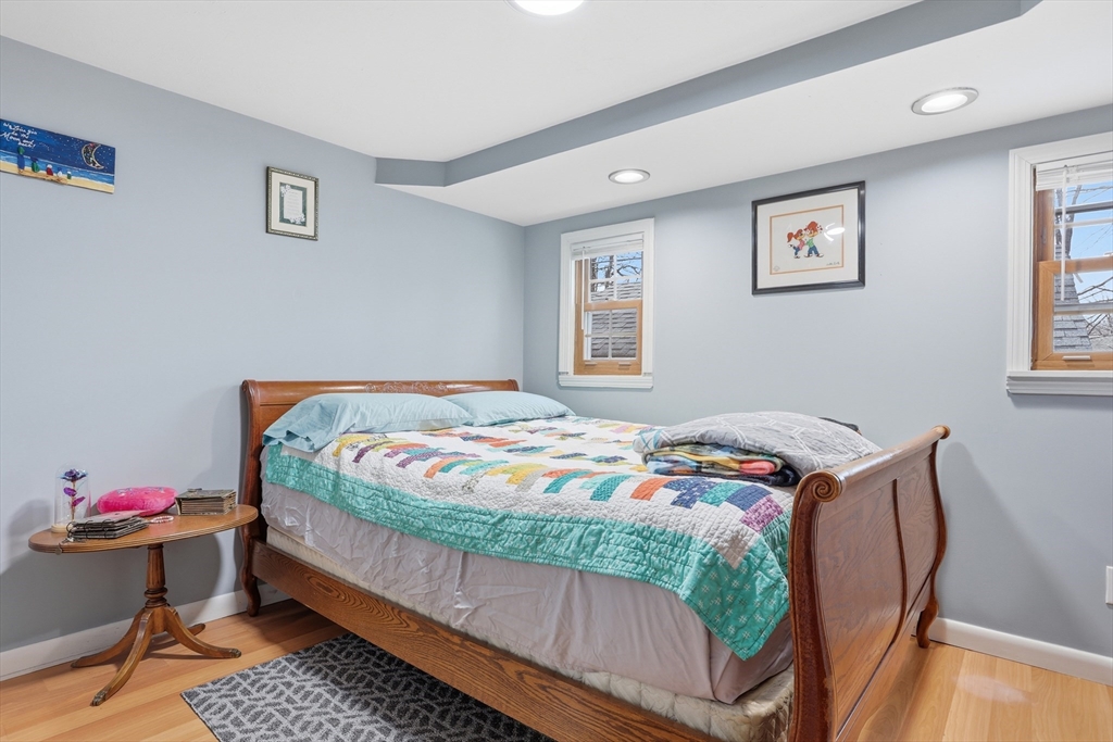 181 Boston Post Road East, Unit 34 Marlborough, MA 01752 - Photo 14 of 29 a bedroom with a bed and wooden floor