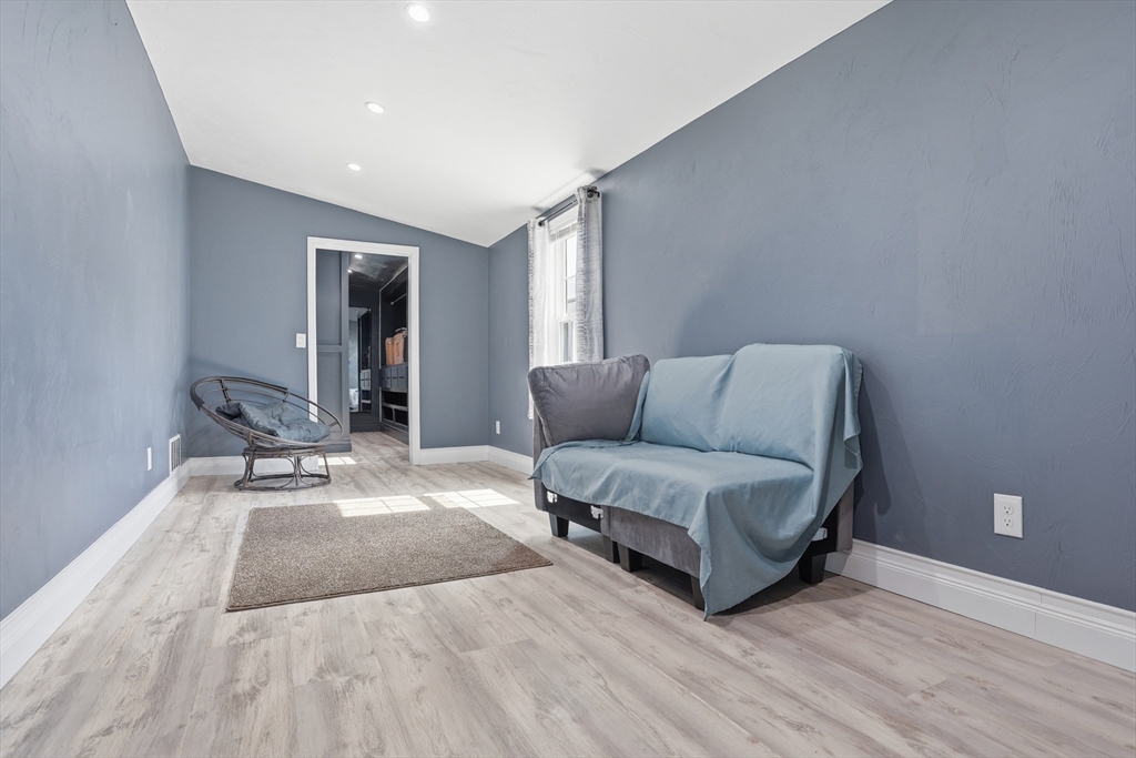 181 Boston Post Road East, Unit 34 Marlborough, MA 01752 - Photo 17 of 29 a living room with furniture and a rug
