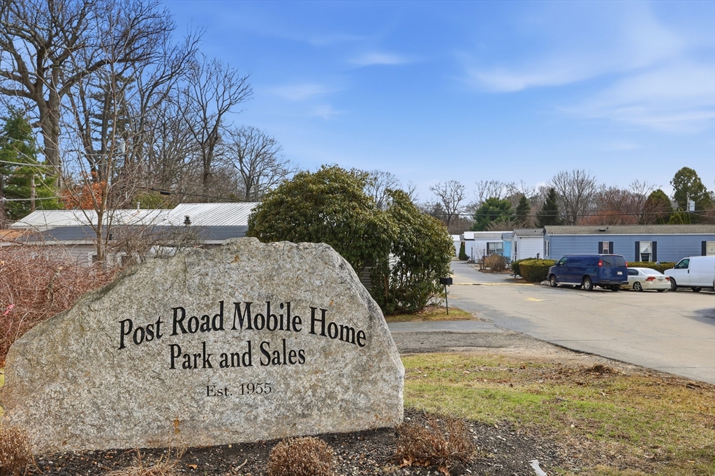 181 Boston Post Road East, Unit 34 Marlborough, MA 01752 - Photo 22 of 29 a view of a park that has a sign board large parking space