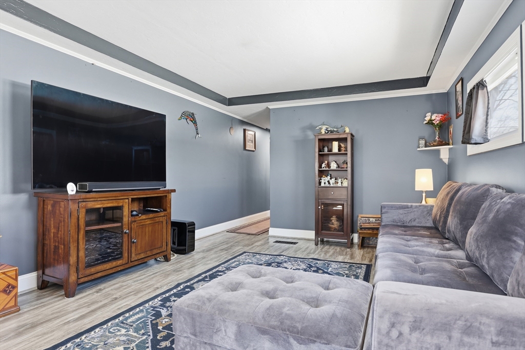 181 Boston Post Road East, Unit 34 Marlborough, MA 01752 - Photo 10 of 29 a living room with furniture and a flat screen tv