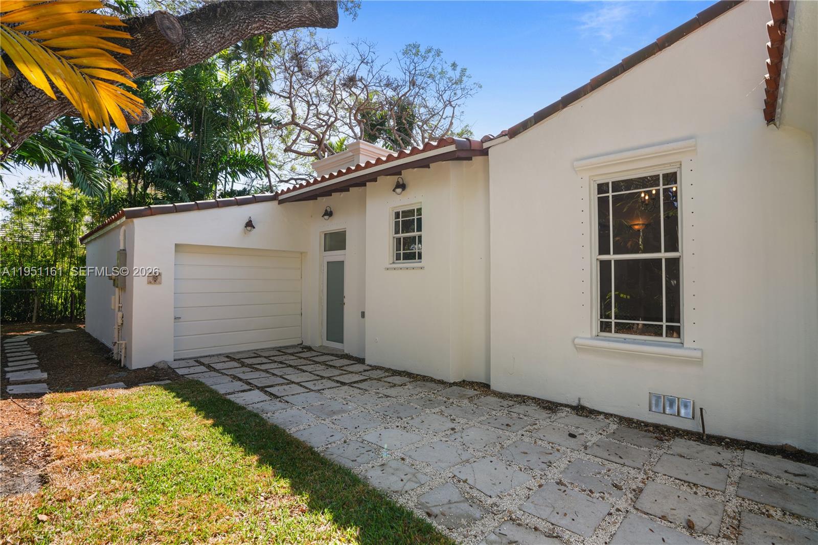1413 El Rado Street Coral Gables, FL 33134 - Photo 13 of 20 a house with a small yard