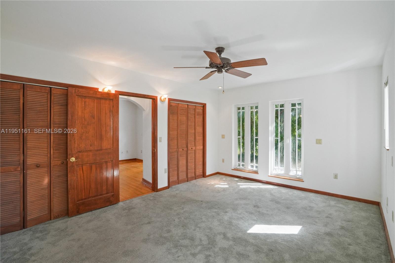 1413 El Rado Street Coral Gables, FL 33134 - Photo 15 of 20 a view of a livingroom with a ceiling fan and window