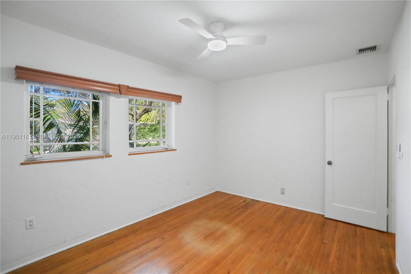 1413 El Rado Street Coral Gables, FL 33134 - Photo 18 of 20 a view of empty room with wooden floor and fan