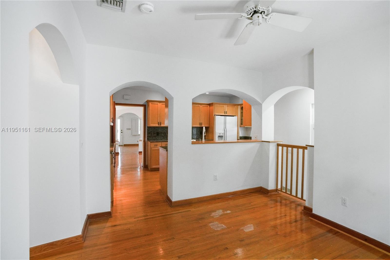 1413 El Rado Street Coral Gables, FL 33134 - Photo 9 of 20 a view of an empty room with window and wooden floor