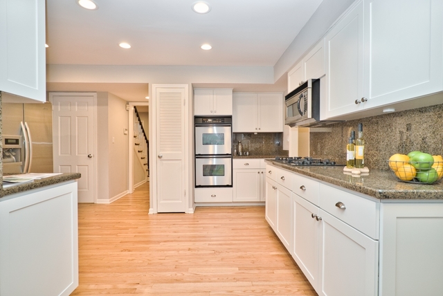 4052 Michelline Lane Northbrook, IL 60062 - Photo 16 of 44 a kitchen with stainless steel appliances granite countertop a sink and cabinets