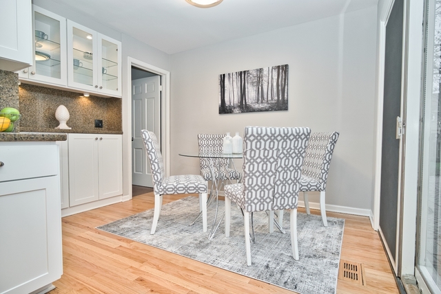 4052 Michelline Lane Northbrook, IL 60062 - Photo 17 of 44 a dining room with furniture and wooden floor