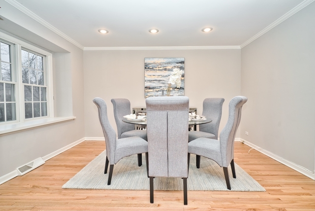 4052 Michelline Lane Northbrook, IL 60062 - Photo 21 of 44 a view of a dining room with furniture and wooden floor