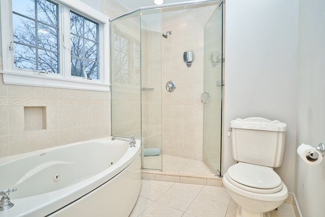 4052 Michelline Lane Northbrook, IL 60062 - Photo 29 of 44 a bathroom with a toilet and shower