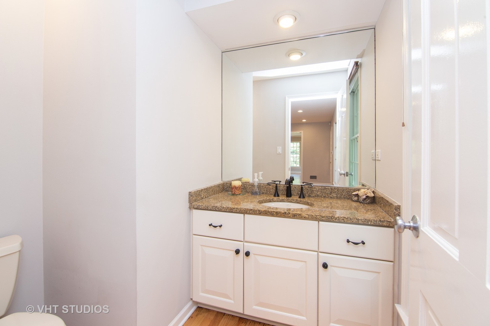 4052 Michelline Lane Northbrook, IL 60062 - Photo 31 of 44 a bathroom with a granite countertop sink and a mirror