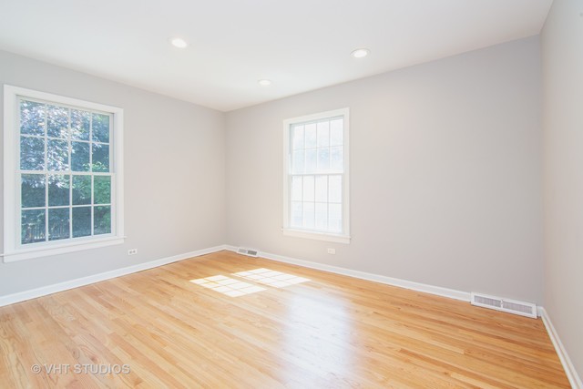 4052 Michelline Lane Northbrook, IL 60062 - Photo 37 of 44 a view of an empty room with wooden floor and a window