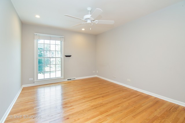 4052 Michelline Lane Northbrook, IL 60062 - Photo 38 of 44 an empty room with wooden floor and windows