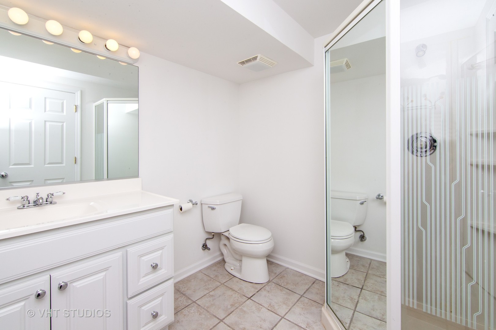 4052 Michelline Lane Northbrook, IL 60062 - Photo 39 of 44 a bathroom with a sink a toilet a mirror and shower