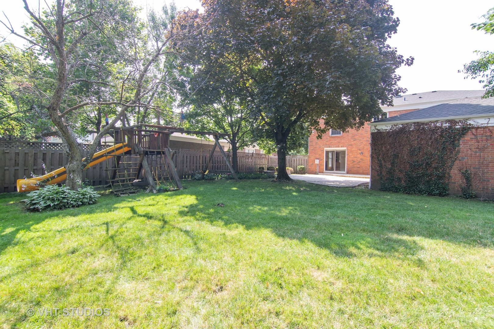 4052 Michelline Lane Northbrook, IL 60062 - Photo 43 of 44 a view of a backyard with table and chairs and a slide