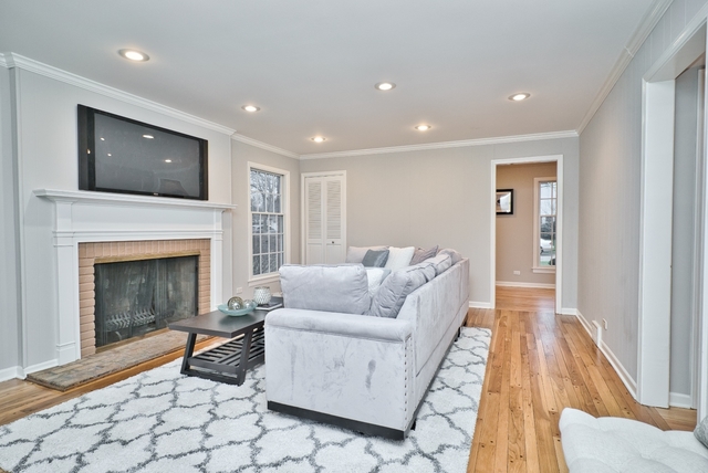 4052 Michelline Lane Northbrook, IL 60062 - Photo 7 of 44 a living room with furniture and a fireplace