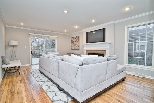 4052 Michelline Lane Northbrook, IL 60062 - Photo 8 of 44 a living room with furniture and a flat screen tv