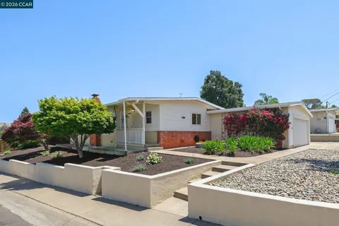 a front view of a house with yard