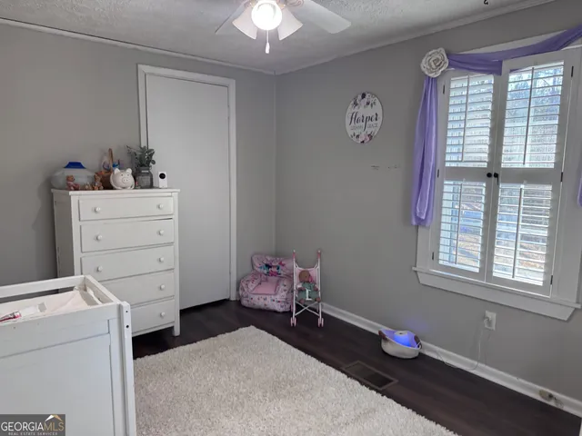 a room with toys and dresser