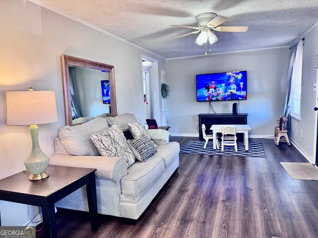 a living room with furniture a dining table with wooden floor