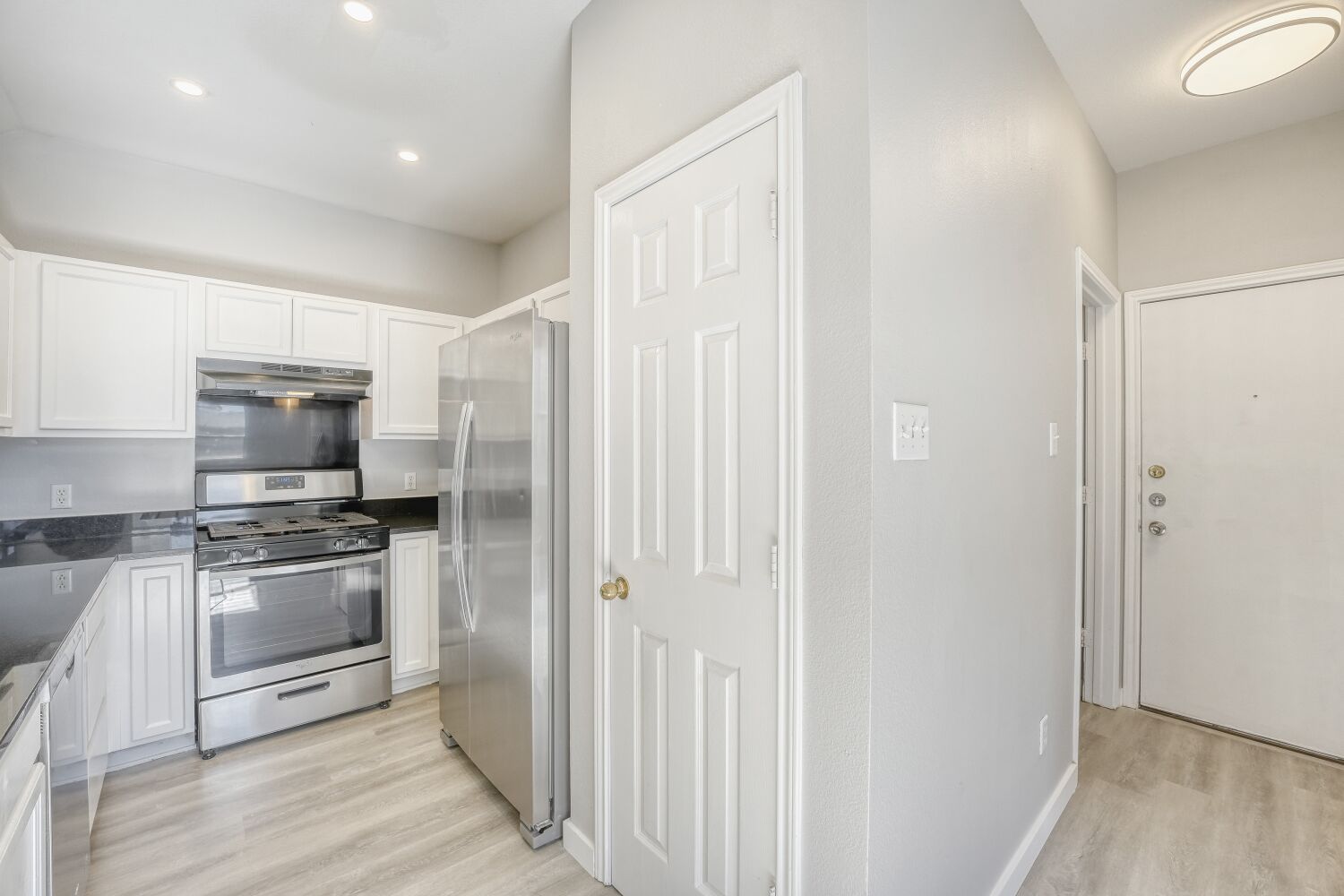 904 Sebastian Bend, Unit B Pflugerville, TX 78660 - Photo 10 of 30 a kitchen with stainless steel appliances granite countertop a refrigerator and a stove top oven