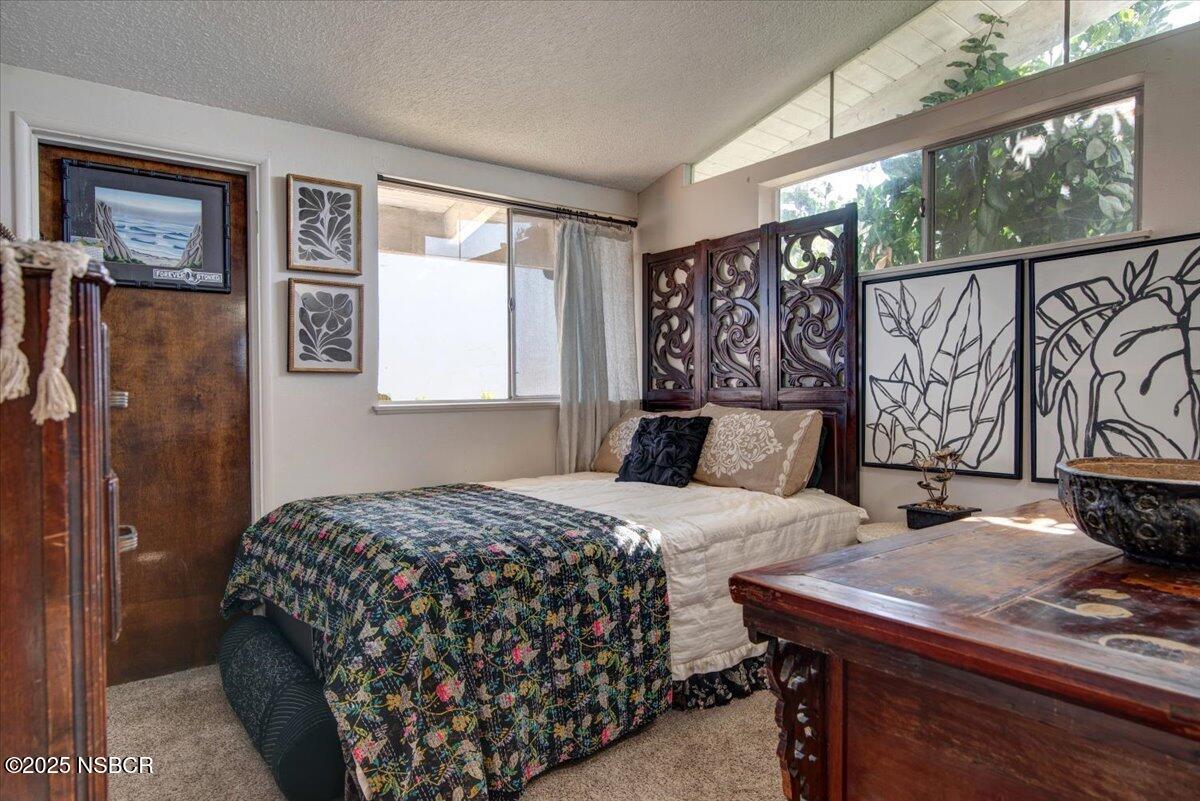 321 North Sixth Street Lompoc, CA 93436 - Photo 13 of 30 a bedroom with a bed and window