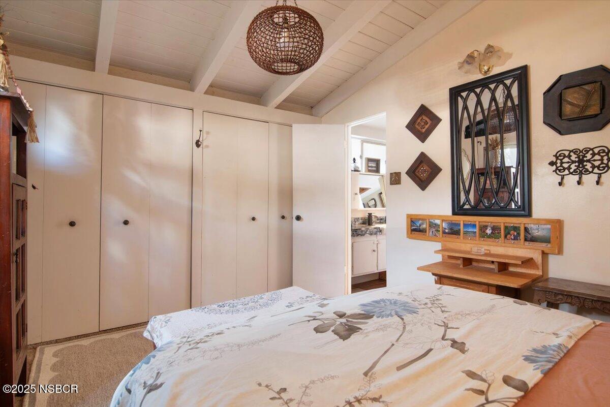 321 North Sixth Street Lompoc, CA 93436 - Photo 21 of 30 a bedroom with a bed and a bathroom in it