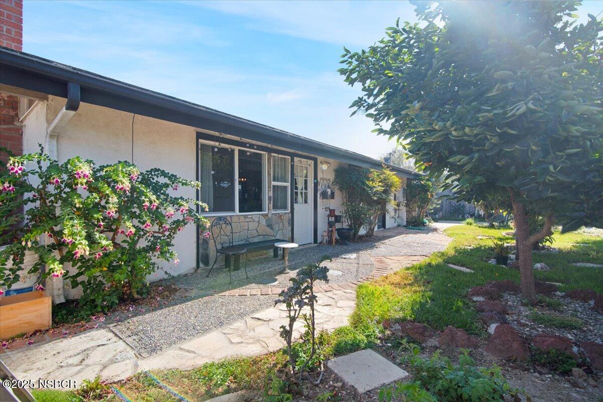 321 North Sixth Street Lompoc, CA 93436 - Photo 23 of 30 a view of a house with backyard and sitting area