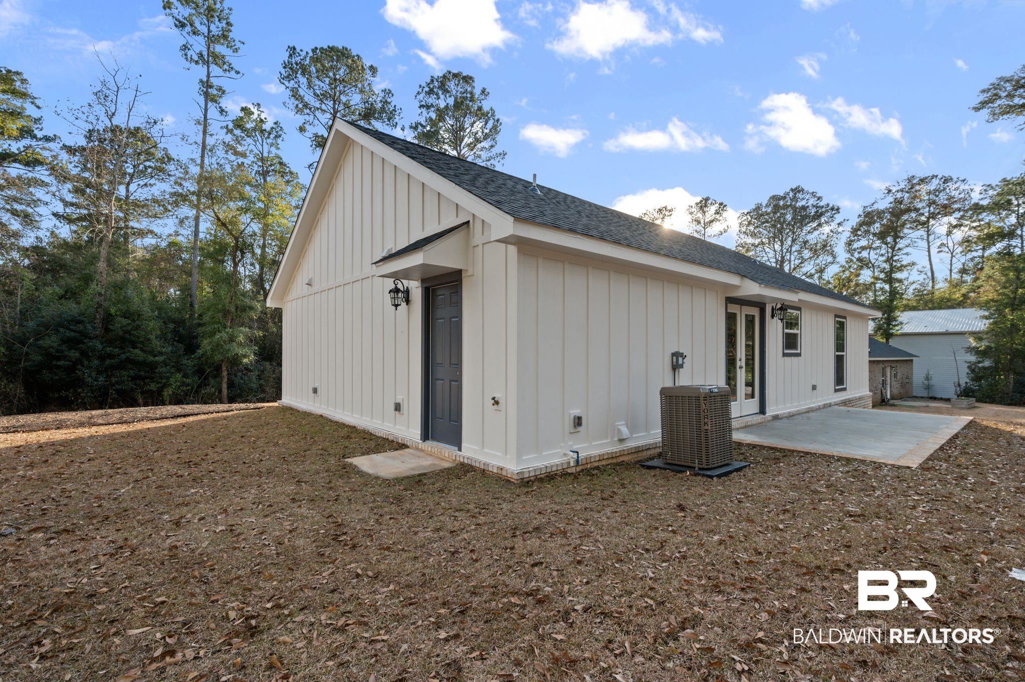 1473 Pollard Road Daphne, AL 36526 - Photo 32 of 32 Exterior space with a patio and central AC