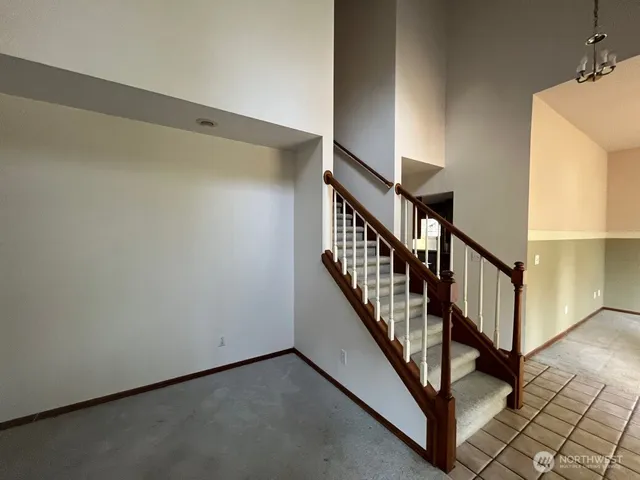 a view of a hallway with staircase