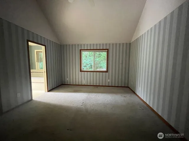 an empty room with windows