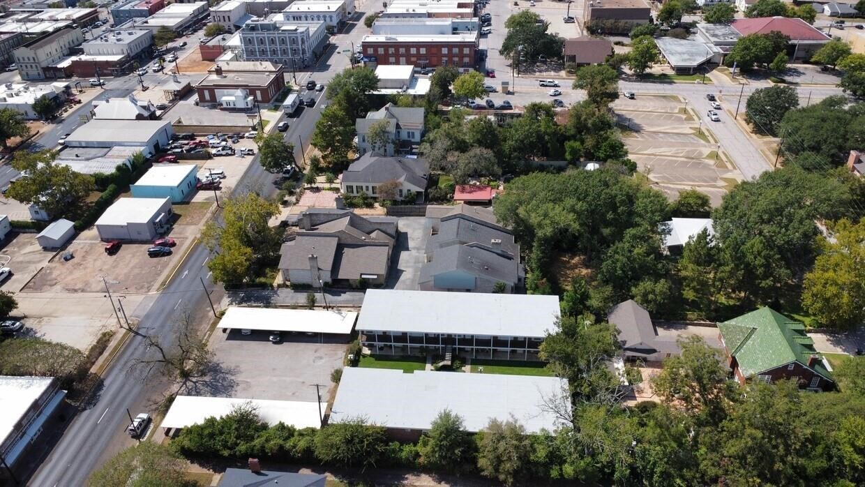 401 East Main Street, Unit 5 Brenham, TX 77833 - Photo 18 of 18 an aerial view of multiple houses with yard