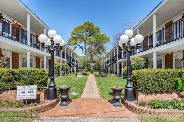 an aerial view of multiple houses with yard
