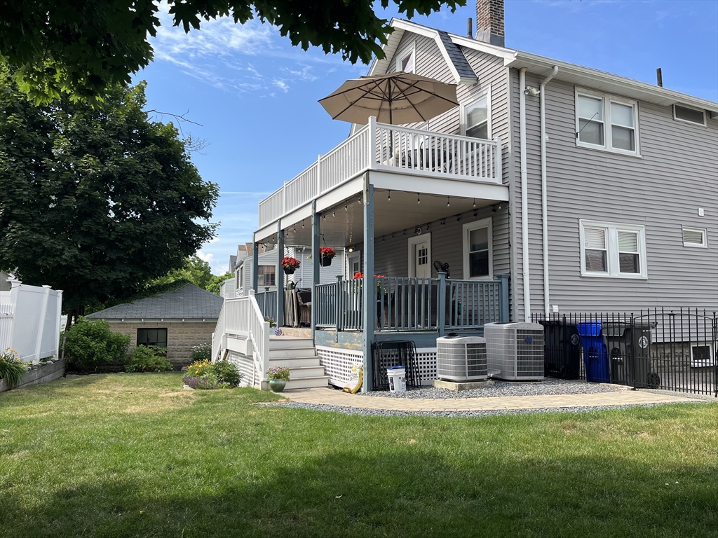 30-32 Moulton Road, Unit 32 Arlington, MA 02476 - Photo 11 of 12 a view of a house with backyard and porch