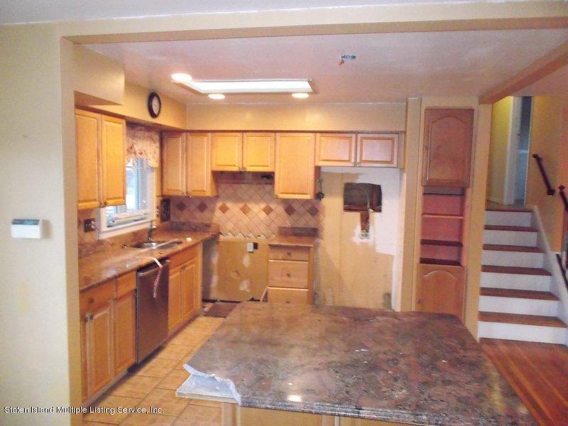1 Sarno Street Colonia, NJ 07067 - Photo 10 of 30 a kitchen with stainless steel appliances granite countertop a refrigerator and a stove top oven