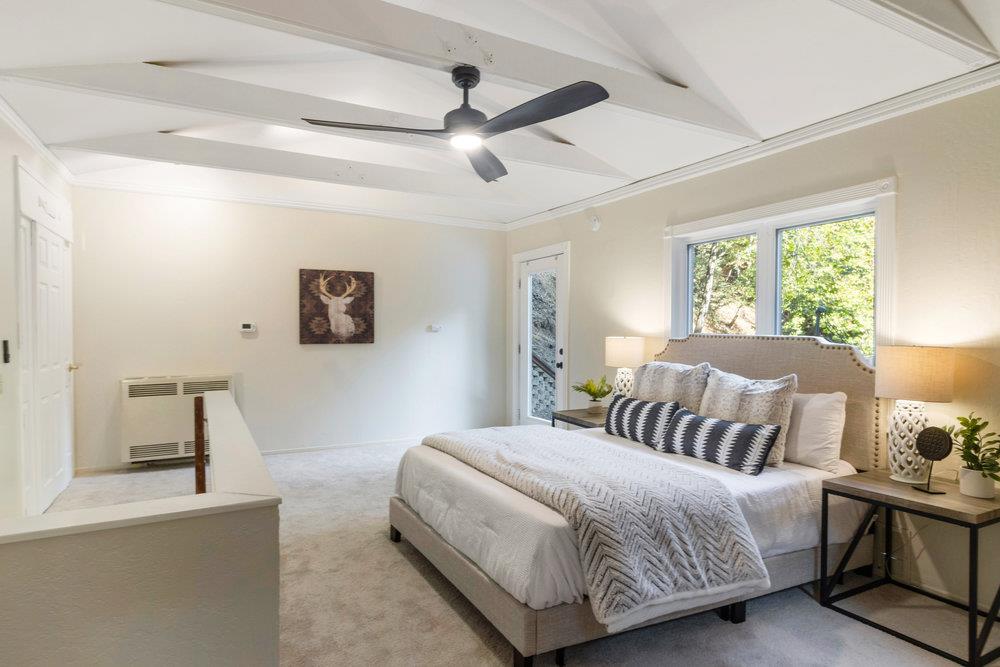 19495 Beardsley Road Los Gatos, CA 95033 - Photo 18 of 63 a bedroom with a bed and a chandelier