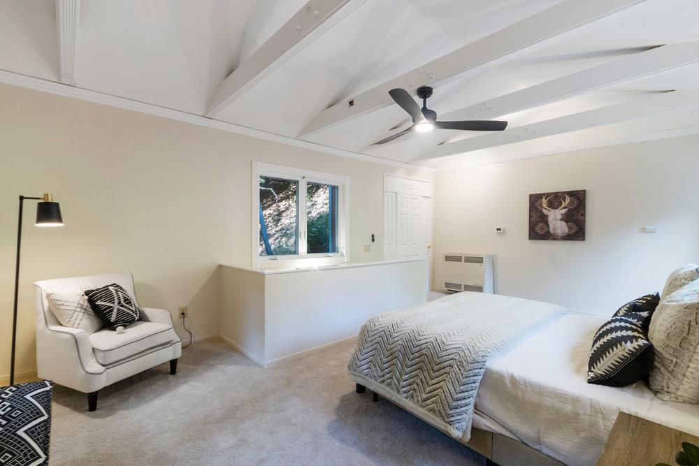 19495 Beardsley Road Los Gatos, CA 95033 - Photo 20 of 63 a bedroom with a bed and a couch