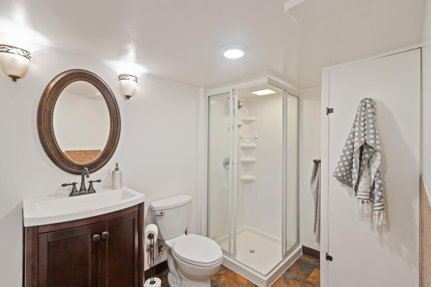 19495 Beardsley Road Los Gatos, CA 95033 - Photo 33 of 63 a bathroom with a sink a toilet and a mirror