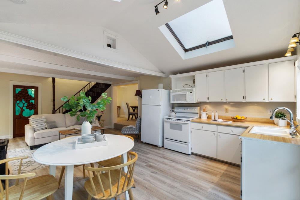 19495 Beardsley Road Los Gatos, CA 95033 - Photo 10 of 63 a open kitchen with stainless steel appliances granite countertop a stove refrigerator and white cabinets with wooden floor