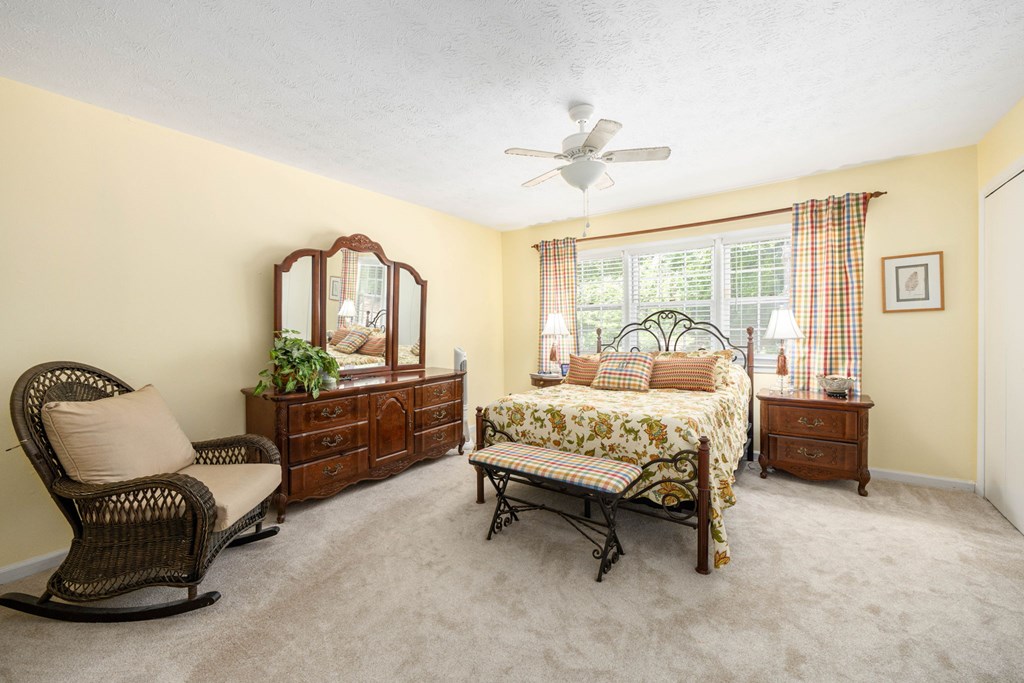 6101 River Road, Unit 15 Columbus, GA 31904 - Photo 15 of 22 a bedroom with a bed chair and a window