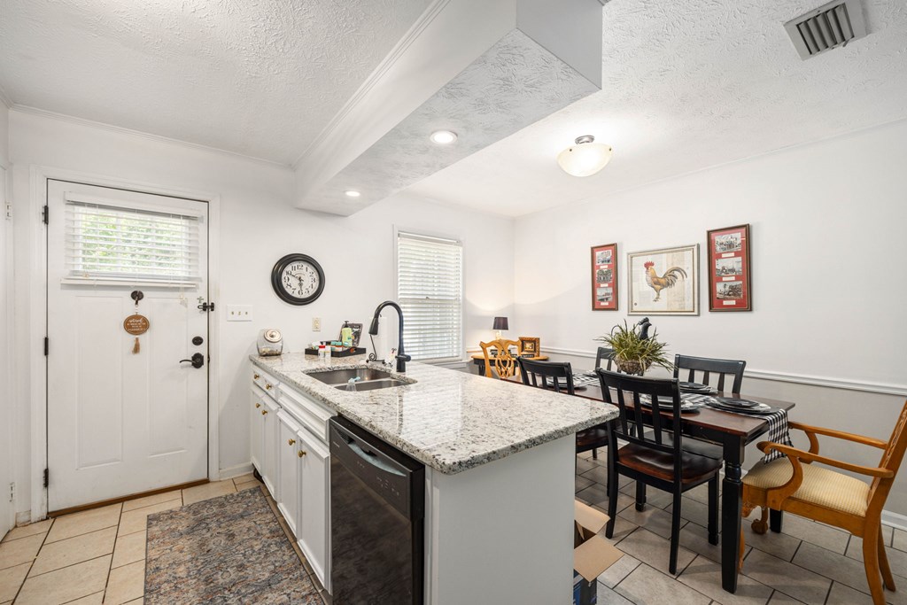 6101 River Road, Unit 15 Columbus, GA 31904 - Photo 10 of 22 a kitchen with a sink and stove