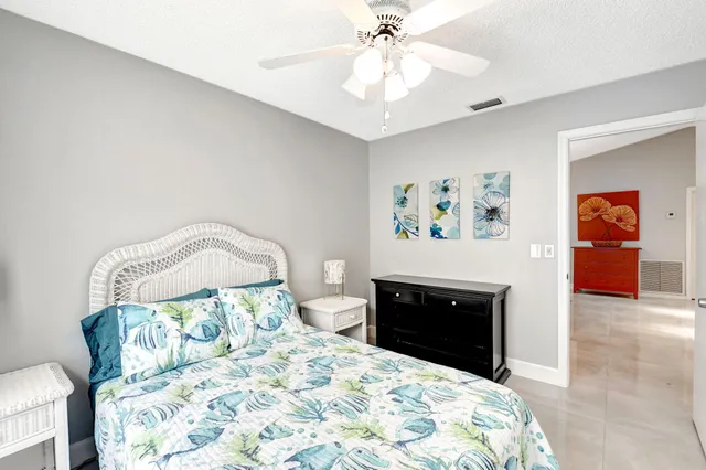 a bedroom with two beds and a window