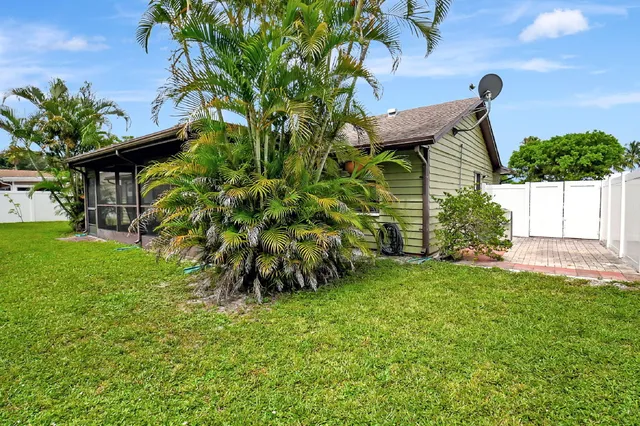 a house with garden in front of it