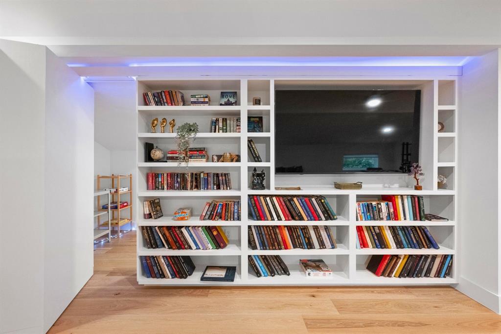 4604-2 Santa Anna Street Austin, TX 78721 - Photo 5 of 7 a view of room with cabinets and book shelf