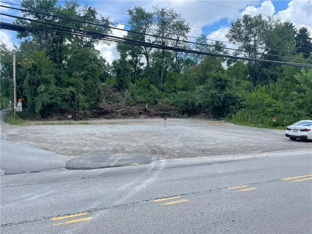a view of a road with a trees